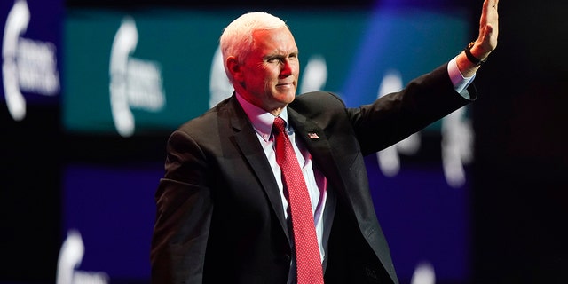 Vice President Mike Pence waves as he leaves the stage after speaking at the Turning Point USA Student Action Summit, Tuesday, December 22, 2020, in West Palm Beach, Fla. (AP Photo / Lynne Sladky)