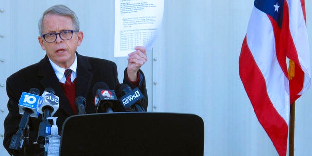 Republican Ohio Gov. Mike DeWine speaks during a news briefing at John Glenn International Airport in Columbus, Ohio, on Nov. 18, 2020.