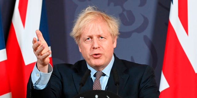 .Britain's Prime Minister Boris Johnson speaks during a media briefing in Downing Street in London on Dec. 24. (AP)