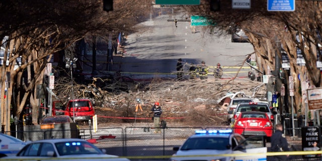 Investigators continue to examine the site of an explosion Sunday, Dec. 27, 2020, in downtown Nashville, Tenn. (AP Photo/Mark Humphrey)