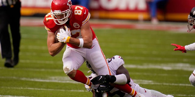 Kansas City Chiefs tight end Travis Kelce is tackled by Atlanta Falcons Foyesade Oluokun during the first half of an NFL football game, Sunday, Dec. 27, 2020, in Kansas City. (AP Photo/Jeff Roberson)