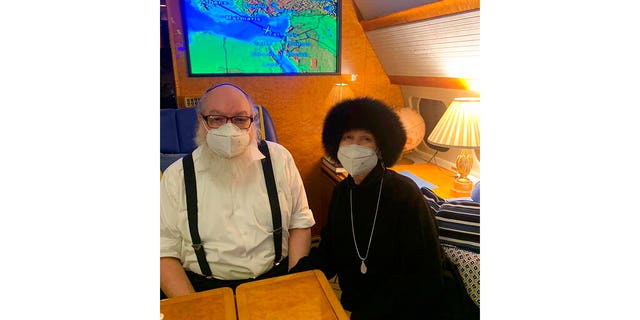 Jonathan Pollard, links, and his wife Esther sit inside a private plane provided by American casino magnate Sheldon Adelson, on route to land in Ben Gurion International airport near Tel Aviv.