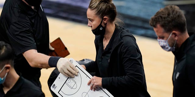 San Antonio Spurs assistant coach Becky Hammon breaks from a huddle during a timeout in the second half of an NBA basketball game against the Los Angeles Lakers in San Antonio, Wednesday, Dec. 30, 2020. Hammon became the first woman to direct an NBA team, taking over the Spurs after coach Gregg Popovich was ejected in a 121-107 loss to the Lakers. (Associated Press)