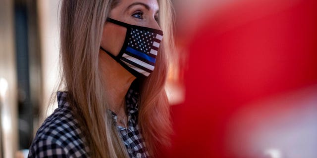 U.S. Senator Kelly Loeffler, R-Ga., Chats with supporters during a campaign event December 31 at McCray's Tavern in Marietta, Ga. (AP Photo / Ben Gray)