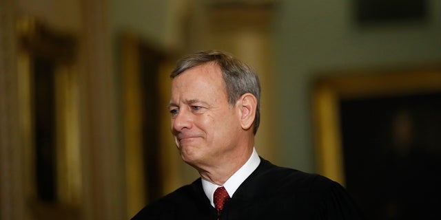 In this Jan. 16, 2020, file photo Chief Justice of the United States, John Roberts walks to the Senate chamber at the Capitol in Washington. (AP Photo/Matt Rourke, File)