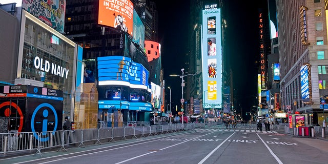 Seventh Avenue in New York City was mostly empty during what would normally be a Times Square packed with people, late Thursday, Dec. 31, 2020, as celebrations have been truncated this New Year's Eve due to the ongoing pandemic. (Associated Press)