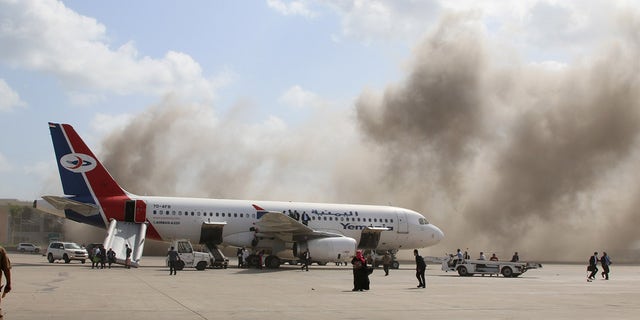 Dust rises after explosions hit Aden airport upon the arrival of the newly-formed Yemeni government, on Dec. 30. (Reuters)