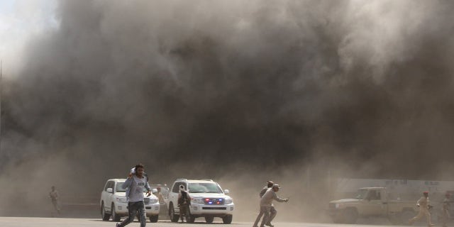 Dust rises after the explosion rocked the airport. 