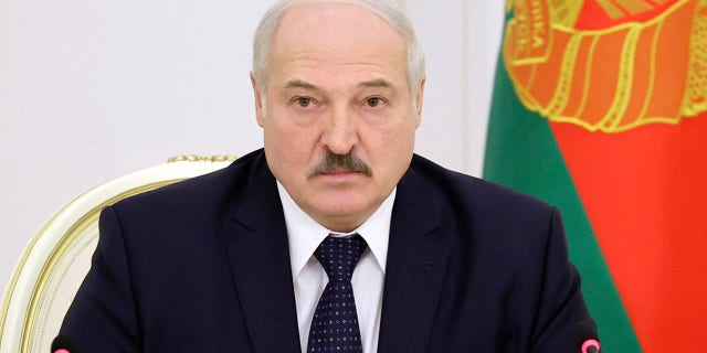 Belarusian President Alexander Lukashenko attends a meeting on the work of the economy in the current year in Minsk, Belarus, Monday, Dec. 7, 2020. (Maxim Guchek/BelTA Pool Photo via AP)