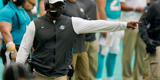Miami Dolphins head coach Brian Flores gestures during the second half of a game against the Cincinnati Bengals, Sunday, Dec. 6, 2020, in Miami Gardens, Florida. (AP Photo/Wilfredo Lee)