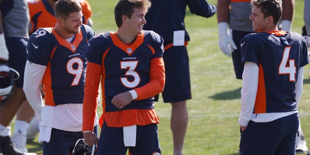 FILE - Denver Broncos quarterback Drew Lock, center, jokes with backup quarterbacks Jeff Driskel, left, and Brett Rypien during an NFL football practice in Englewood, Colo., in this Monday, Aug. 31, 2020, file photo. The Broncos activated three quarterbacks—starter Lock and backups Rypien and Blake Bortles—from the COVID-19 list Tuesday, Dec. 1, 2020, to insure that the team will not be without quarterbacks on the roster for the game against the Chiefs in Kansas City on Sunday as the Broncos were last Sunday when hosting the New Orleans Saints. (AP Photo/David Zalubowski, File)