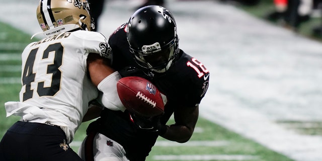 New Orleans Saints free safety Marcus Williams (43) hits Atlanta Falcons wide receiver Calvin Ridley (18) during the second half of an NFL football game, Sunday, Dec. 6, 2020, in Atlanta. (AP Photo/Brynn Anderson)