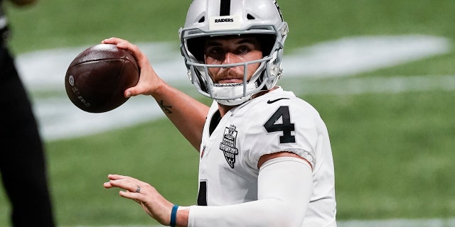 Las Vegas Raiders quarterback Derek Carr works in the pocket against the Atlanta Falcons during the second half of an NFL football game, Sunday, Nov. 29, 2020, in Atlanta. (AP Photo/John Bazemore)