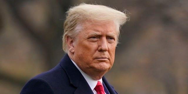 In this December 12, 2020 file photo, President Donald Trump walks on the South Lawn of the White House in Washington before boarding Marine One.