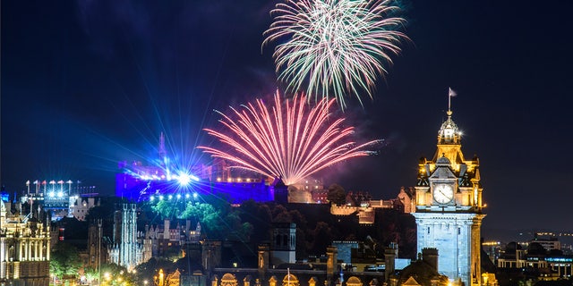 Edinburgh, Scotland - August 15, 2017: The scenic summer fireworks in Edinburgh during the Royal Military Tattoo and Fringe Festival.