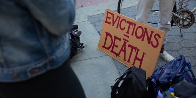A sign reads "Evictions = Death" during a protest in Foley Square in New York on Oct. 1, 2020. (Paul Frangipane/Bloomberg via Getty Images)