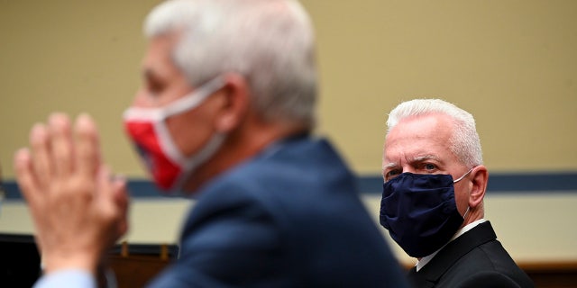 WASHINGTON, DC - JULY 31: Admiral Brett Giroir, U.S. assistant secretary for health (R), and Anthony Fauci, director of the National Institute of Allergy and Infectious Diseases. (Photo by Erin Scott-Pool/Getty Images)