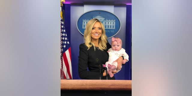 McEnany and her daughter, Blake, at the podium in the White House press briefing room after her first briefing on May 1, 2020.