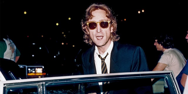 Former Beatle John Lennon arrives at the Times Square recording studio "The Hit Factory" before a recording session of his final album 'Double Fantasy' in August 1980 in New York City, New York.