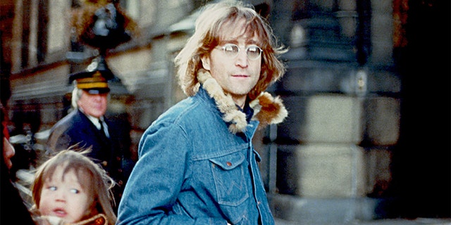 Former Beatle John Lennon poses for a photo with his wife Yoko Ono and son Sean Lennon in 1977 in New York City. 