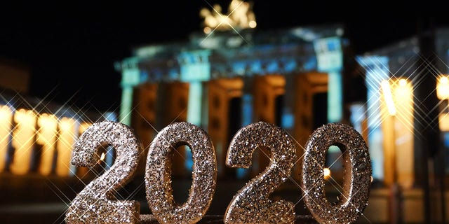 FILE -- Berlin: The number 2020 is in front of the Brandenburg Gate on Pariser Platz in Berlin Mitte. Photo: XAMAX/dpa (Photo by XAMAX/picture alliance via Getty Images)