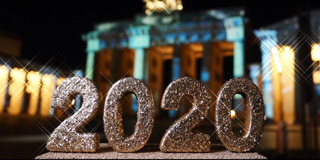 FILE -- Berlin: The number 2020 is in front of the Brandenburg Gate on Pariser Platz in Berlin Mitte. Photo: XAMAX/dpa (Photo by XAMAX/picture alliance via Getty Images)