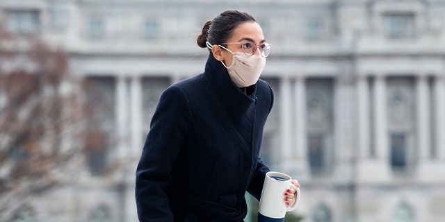 Rep. Alexandria Ocasio-Cortez, D-N.Y., on the House steps of the Capitol during votes, Dec. 4, 2020. (Tom Williams/CQ-Roll Call, Inc via Getty Images)