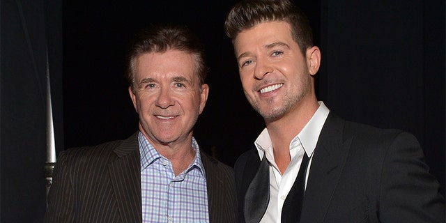 Robin Thicke (right) took to Instagram where he honored his late father Alan Thicke (left).