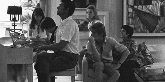 Entertainer Dean Martin with his wife Jeanne and children (Deana, Gina, Ricci and Dean Paul) spending family time in their Los Angeles, Calif. home, circa 1966.