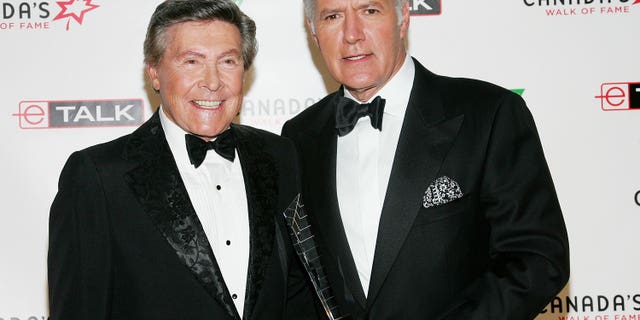 Johnny Gilbert -- the voice behind 'Jeopardy!' -- is remembering the late Alex Trebek. Gilbert and Trebek reportedly met at an industry convention before the relaunch of the game show in 1984. (Photo by Evan Agostini/Getty Images for Chanel)