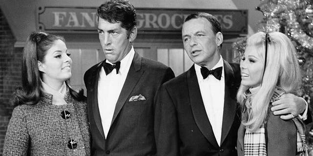 L-R: Entertainers Deana Martin, Dean Martin, Frank Sinatra and Nancy Sinatra performing on a Christmas special in December 1967.