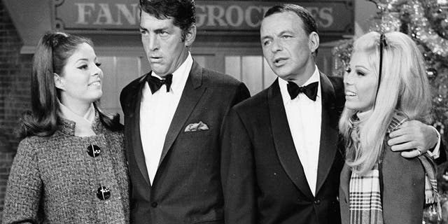 L-R: Entertainers Deana Martin, Dean Martin, Frank Sinatra and Nancy Sinatra performing on a Christmas special in December 1967.