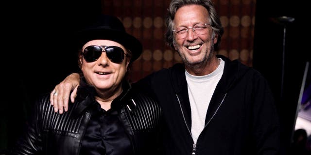 Eric Clapton and Van Morrison worked on "Stand and Deliver," a song that is critical about coronavirus lockdowns. (Photo by Listen To The Lion/Lobeline Communcations via Getty Images)