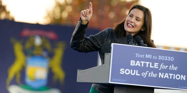 FILE - Gov. Gretchen Whitmer, D-Mich., speaks before Democratic presidential candidate former Vice President Joe Biden and former President Barack Obama speak at a rally at Belle Isle Casino in Detroit, Mich., Saturday, Oct. 31, 2020. (AP Photo/Andrew Harnik)