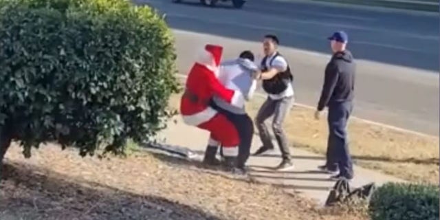 Video of a video of a secret officer arresting a suspected car thief as Santa Claus on Thursday in Riverside, California (Riverside Police Department)