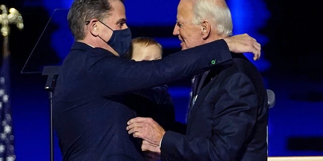In this Nov. 7, 2020, file photo, President-elect Joe Biden, right, embraces his son Hunter Biden, left, in Wilmington, Del. Biden’s son Hunter says he has learned from federal prosecutors that his tax affairs are under investigation. 