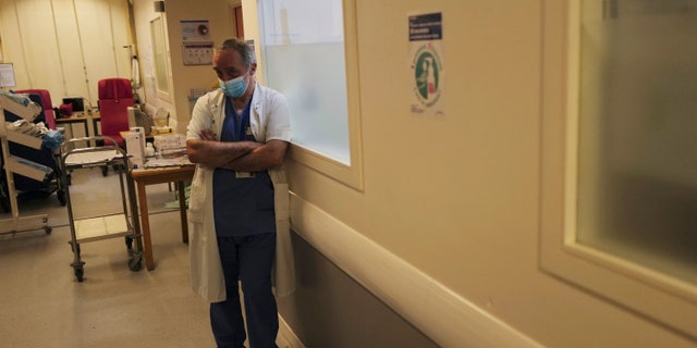 Dr. Philippe Montravers is pictured next to room No. 10, hours before the patient inside died after his nearly month-long battle against COVID-19 at Bichat Hospital.