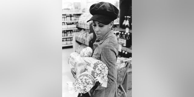 Tina Turner buying bread in a Los Angeles grocery store, circa 1971.