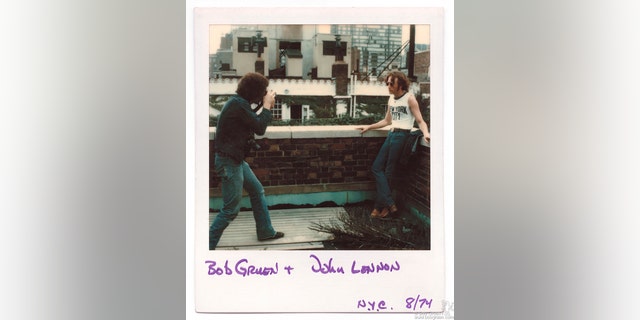 Polaroid of Bob Gruen taking a photo of John Lennon wearing a NYC t-shirt, circa 1974.