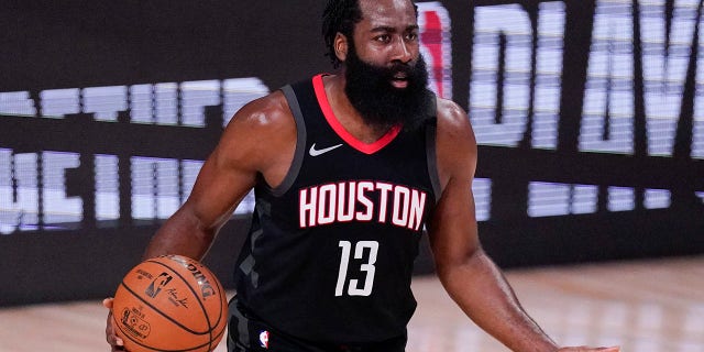 FILE - In this September 12, 2020 file photo, James Harden (13) of the Houston Rockets discusses an appeal during the first half of an NBA Conference Semifinal basketball game against the Los Angeles Lakers in Lake Buena Vista, Fla. (AP Photo)