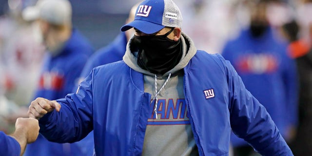 New York Giants head coach Joe Judge is greeted after an NFL football game against the Seattle Seahawks, Sunday, Dec. 6, 2020, in Seattle. The Giants won 17-12. (AP Photo/Larry Maurer)