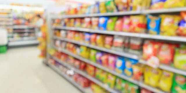 Supermarket convenience store shelves with potato chips 