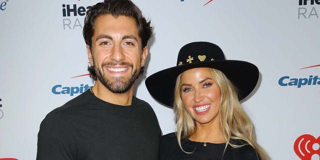 Jason Tartick (left) and Kaitlyn Bristowe (right) say they have contracted coronavirus after having a visitor in their home. (Photo by JC Olivera/Getty Images)