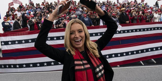 White House press secretary Kayleigh McEnany dances to "YMCA," after President Donald Trump spoke at a campaign rally at Lancaster Airport, Monday, Oct. 26, 2020, in Lititz, Pa. (AP Photo/Alex Brandon)