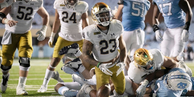 Notre Dame's Kyren Williams (23) reacts after scoring on a 1-yard carry against North Carolina during an NCAA college football game Friday, Nov. 27, 2020, in Chapel Hill, N.C. (Robert Willett/The News & Observer via AP, Pool)