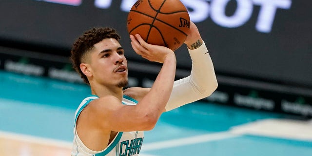 Charlotte Hornets guard LaMelo Ball shoots against the Toronto Raptors during the second half of an NBA preseason basketball game in Charlotte, N.C., on Saturday, Dec. 12, 2020. (AP Photo/Chris Carlson)