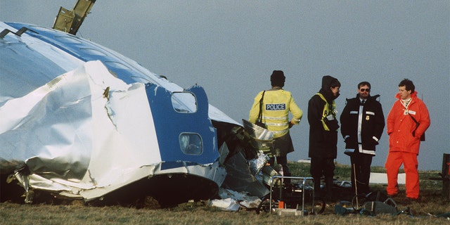 Scottish rescue workers and crash investigators search the area around the cockpit of Pan Am flight 103 in a farmer's field east of Lockerbie Scotland after a mid-air bombing killed all 259 passengers and crew, and 11 people on the ground. 