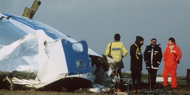 Scottish rescue workers and crash investigators search the area around the cockpit of Pan Am flight 103 in a farmer's field east of Lockerbie Scotland after a mid-air bombing killed all 259 passengers and crew, and 11 people on the ground.