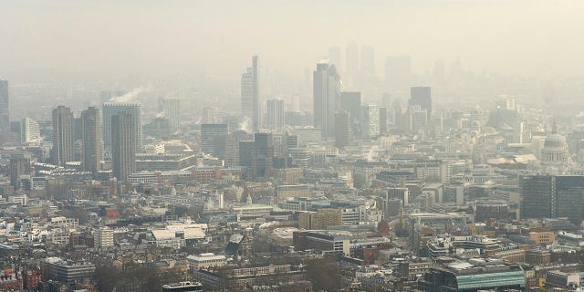 Aerial view of London's financial district in the fog.