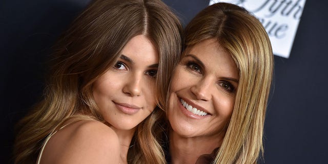 Actress Lori Loughlin (right) and daughter Olivia Jade (left) reunited after Loughlin was released from prison on December 28. 